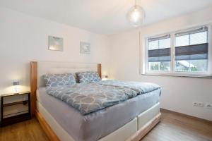 Ένα ή περισσότερα κρεβάτια σε δωμάτιο στο Wohnung Sonnentau