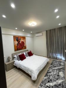 En eller flere senge i et værelse på Amy's Comfort Maisonette