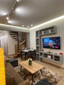 Et tv og/eller underholdning på Amy's Comfort Maisonette