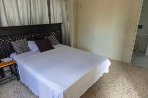 Uma cama ou camas num quarto em Nics Appartments - Relaxing vacation 5 min from different beaches