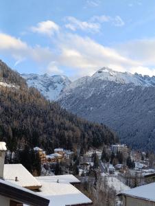 a view of a mountain range with snow covered mountains at Villa Emma in Ponte di Legno