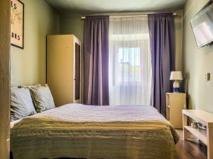 Posteľ alebo postele v izbe v ubytovaní Mi Casa Vendégház - Apartments + 37 fotografií