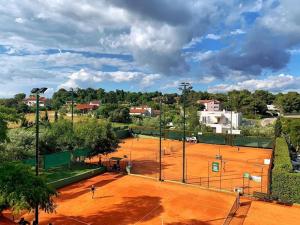 an overhead view of a tennis court at Caramel Comforts in Stinjan only 800 m from the Beach, free parking in Pula +2 photos