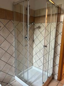 a shower with a glass enclosure in a bathroom at HIDE by the Sea in Ortona +25 photos