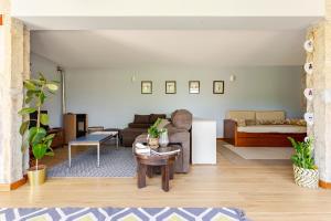 a living room with a couch and a table at Quinta Santo António Amares in Amares +20 photos