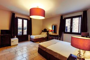 Postel nebo postele na pokoji v ubytování Vico Regio Hotel