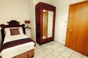 Voodi või voodid majutusasutuse Vico Regio Hotel toas