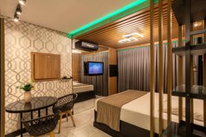 Ένα ή περισσότερα κρεβάτια σε δωμάτιο στο Hotel Motel Paradiso - Cruz Alta-RS