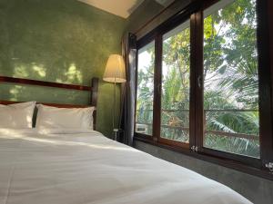 Postel nebo postele na pokoji v ubytování COCO HOME Homestay(โคโค่โฮม)