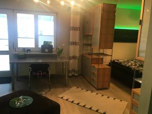 a room with a desk and a bed and a table at Apartment Schwabthal by Landhaus Staffelstein in Bad Staffelstein
