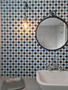 a bathroom with a mirror and a sink at Abella Maison, Kythnos in Kithnos +21 photos