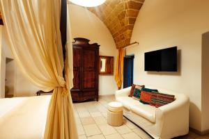 TV a/nebo společenská místnost v ubytování Vico Regio Hotel