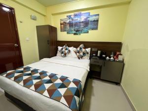 Postel nebo postele na pokoji v ubytování Tourist Inn