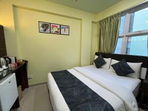 Postel nebo postele na pokoji v ubytování Tourist Inn