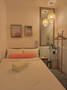 Postel nebo postele na pokoji v ubytování Akap Homestay - Nkd