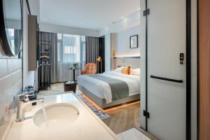 Lijiang MΛISON Hotel客房内的一张或多张床位