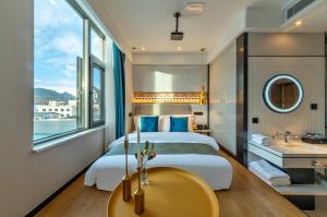 Lijiang MΛISON Hotel客房内的一张或多张床位