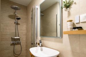 a bathroom with a sink and a shower at 150m to Beach - Free Parking - Garden View in Slano +51 photos