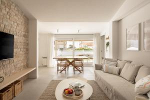 a living room with a couch and a table at A Casiña in Nigrán