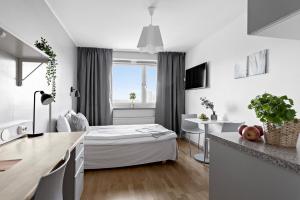 Postel nebo postele na pokoji v ubytování Forenom Aparthotel Stockholm Alvik