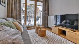 TV a/nebo společenská místnost v ubytování Mariental Residence, Sun & Snow