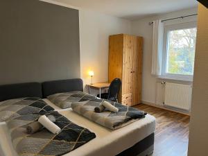 Postel nebo postele na pokoji v ubytování Hotel am Hafen