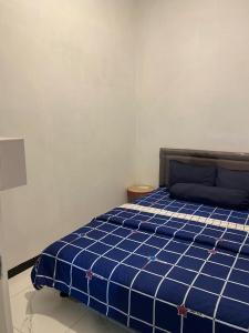 Ένα ή περισσότερα κρεβάτια σε δωμάτιο στο Villa Modern Minimalis Panderman Hill +9 φωτογραφίες