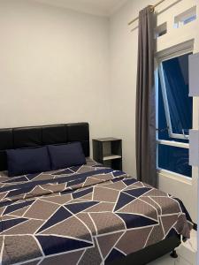 Ένα ή περισσότερα κρεβάτια σε δωμάτιο στο Villa Modern Minimalis Panderman Hill