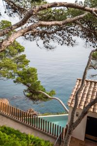a view of the ocean from a house at BYPILLOW Cap Sa Sal in Begur
