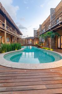a swimming pool in the middle of a building at Pousada Chaves do Paraíso in São Miguel do Gostoso
