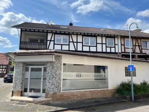 a building with a sign for a yoga wear shelter target at TeamStay Apartments & Boardinghouses in Hellstein
