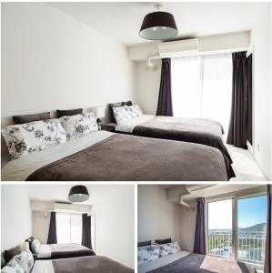 a bedroom with two beds and a window at 27Ams in Sapporo