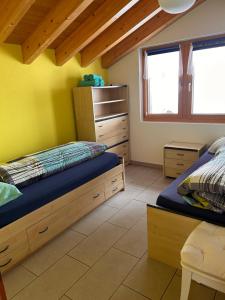 Postel nebo postele na pokoji v ubytování Chalet Adler Bettmeralp + 7 fotografií