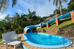 Der Swimmingpool an oder in der Nähe von Morro do Sol Hotel & Eventos