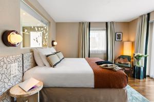 A bed or beds in a room at Hotel D - Basel - Fully Renovated 2025