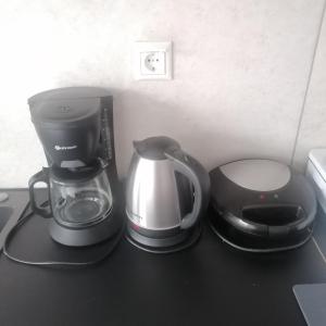 a coffee maker and a blender on a counter at 55sm apartment Voula 4pax in Athens