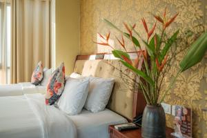 Ένα ή περισσότερα κρεβάτια σε δωμάτιο στο Sunset Westlake Hanoi Hotel