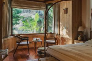 Postel nebo postele na pokoji v ubytování Brij Atmanya Bhowali, Nainital, A Luxury Mountain Escape
