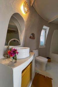 a bathroom with a sink and a toilet at Humbi Farm in Xai-Xai