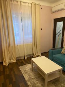 a living room with a couch and a coffee table at House with 2 bedrooms in Bucharest