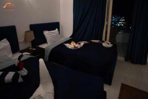 Postel nebo postele na pokoji v ubytování Fox Resort El Gouna Stay