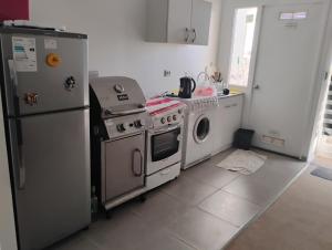 Η κουζίνα ή μικρή κουζίνα στο Departamento para 6 personas en Quintero
