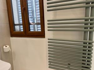 a bathroom with a stack of plates on the wall at Studio du port - Porte marine in Antibes