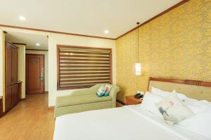 Ένα ή περισσότερα κρεβάτια σε δωμάτιο στο Sunset Westlake Hanoi Hotel
