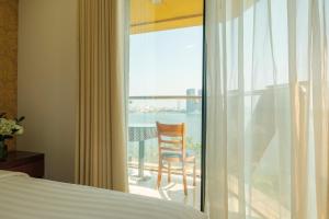 Ένα ή περισσότερα κρεβάτια σε δωμάτιο στο Sunset Westlake Hanoi Hotel