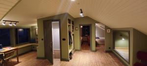 a room with green walls and a room with a desk at Melancholia apartment in Sauðárkrókur
