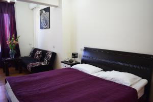 Voodi või voodid majutusasutuse Hotel Grig toas