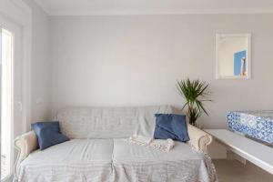 Ένα ή περισσότερα κρεβάτια σε δωμάτιο στο Brisamar Villas OCEANS