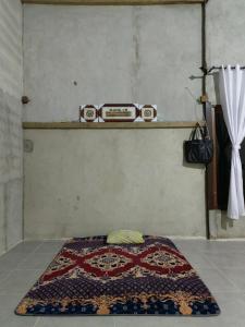 Postel nebo postele na pokoji v ubytování Aqlan Garden House