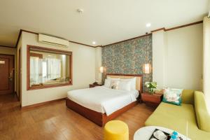 Ένα ή περισσότερα κρεβάτια σε δωμάτιο στο Sunset Westlake Hanoi Hotel